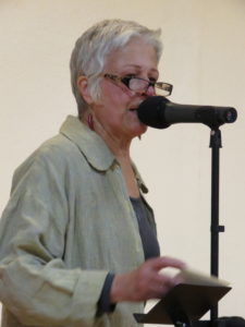 Margaret Mathews at the microphone