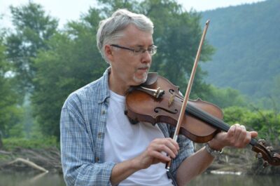 Tom Owens plays the fiddle