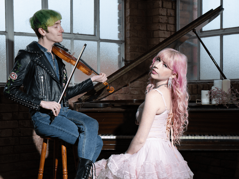 Corwin on stool, Grace at the piano